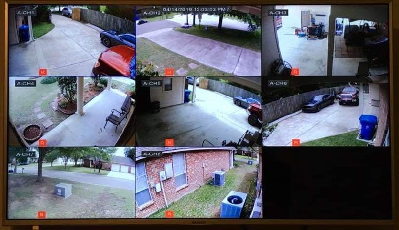 High-Resolution Security Camera Installation - Live video feed on TV.